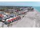 Aerial view showing beachfront condos, community pool, and convenient beach access at 500 Park S Blvd # 62, Venice, FL 34285
