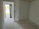 Bedroom featuring a doorway to the outdoor area and freshly painted walls at 500 Park S Blvd # 62, Venice, FL 34285