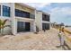 Beachside condos showcase private balconies and entrances, enhanced by a picturesque wooden pathway at 500 Park S Blvd # 62, Venice, FL 34285