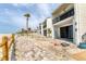 Condo complex highlighting the private balconies and beach access along a charming wooden fence at 500 Park S Blvd # 62, Venice, FL 34285