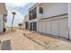 Lovely exterior showcasing unit garages and neatly maintained landscaping at 500 Park S Blvd # 62, Venice, FL 34285