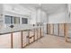 Bright kitchen undergoing renovation with white cabinets and open layout at 500 Park S Blvd # 62, Venice, FL 34285