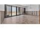 Spacious room with exposed framework, sliding glass doors leading to a beachfront view at 500 Park S Blvd # 62, Venice, FL 34285