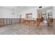 Room with exposed framework offers an open view to the kitchen area with white cabinetry at 500 Park S Blvd # 62, Venice, FL 34285