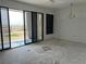 Living room with sliding glass doors leading to the beach, offering panoramic ocean views at 500 Park S Blvd # 62, Venice, FL 34285