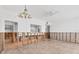 Open-concept room featuring a pass-through to a bright kitchen with exposed framework at 500 Park S Blvd # 62, Venice, FL 34285