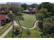 Relax at the community putting green with manicured landscaping and mature trees at 500 Park S Blvd # 62, Venice, FL 34285