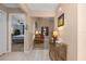 Bright foyer with tile flooring that transitions to wood, leading into a carpeted living space at 500 Wekiva River Ct # 129, Englewood, FL 34223