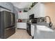 Updated kitchen with modern appliances and a stylish backsplash at 500 Wekiva River Ct # 129, Englewood, FL 34223