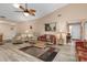 Inviting living room with vaulted ceilings, ceiling fan, and neutral color palette at 500 Wekiva River Ct # 129, Englewood, FL 34223