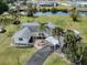 Charming waterfront home with lush landscaping, a covered carport, and easy access to the canal for boating and relaxation at 504 Buena Vista Dr, Nokomis, FL 34275