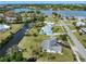 Stunning aerial view of waterfront homes with boat docks and access to the serene bay at 504 Buena Vista Dr, Nokomis, FL 34275