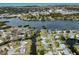 Scenic aerial view of a waterfront community with homes situated along canals and waterways at 504 Buena Vista Dr, Nokomis, FL 34275