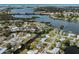 Beautiful aerial view of the waterfront property with a defined lot line, situated on a canal leading to open water at 504 Buena Vista Dr, Nokomis, FL 34275