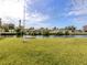Picturesque canal-front backyard offering serene water views, a well-maintained lawn, and a peaceful setting at 504 Buena Vista Dr, Nokomis, FL 34275