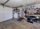 View of the spacious garage area with storage shelving and door leading to interior of the house at 504 Buena Vista Dr, Nokomis, FL 34275