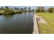 Waterfront view with seawall and dock, perfect for boating and enjoying the water at 504 Buena Vista Dr, Nokomis, FL 34275