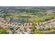 Breathtaking aerial view of the golf course community, showcasing the lake and green landscape from above at 5223 Pine Shadow Ln, North Port, FL 34287