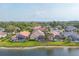 Beautiful lakefront homes with sparkling pools and well-manicured lawns, offering a luxurious lifestyle at 5223 Pine Shadow Ln, North Port, FL 34287