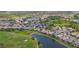 Stunning aerial view of a golf course community with beautiful lakes, lush landscaping, and meticulously maintained homes at 5223 Pine Shadow Ln, North Port, FL 34287
