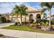 Charming single-story home with lush landscaping, a large garage, and a beautifully designed stucco facade at 5223 Pine Shadow Ln, North Port, FL 34287