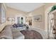 Open-concept living room showcases a cozy sofa and tile flooring at 5223 Pine Shadow Ln, North Port, FL 34287