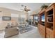 Comfortable living room with neutral decor and access to outdoor patio, a perfect space to relax and enjoy the view at 5223 Pine Shadow Ln, North Port, FL 34287