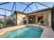 Relaxing screened-in pool with a covered patio, perfect for outdoor dining and entertaining with ease at 5223 Pine Shadow Ln, North Port, FL 34287