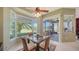 Bright breakfast nook with golf course views and a sliding door to the patio at 525 Cheval Dr, Venice, FL 34292
