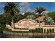 Beautiful entrance sign for the Venice Golf and Country Club, surrounded by lush landscaping and mature palm trees at 525 Cheval Dr, Venice, FL 34292