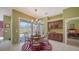 Charming dining area with a view of the pool and convenient access to the bedroom at 525 Cheval Dr, Venice, FL 34292