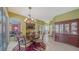 Elegant dining room featuring a chandelier, stylish rug, and convenient built-in bar area at 525 Cheval Dr, Venice, FL 34292