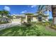 Charming single-story home featuring a lush lawn, well-manicured landscaping, and a two-car garage at 525 Cheval Dr, Venice, FL 34292