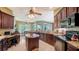 Gourmet kitchen with stainless steel appliances, granite countertops, and a center island at 525 Cheval Dr, Venice, FL 34292