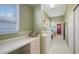 Spacious laundry room with a desk area, and cabinetry for organized storage solutions at 525 Cheval Dr, Venice, FL 34292