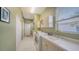 Bright laundry room featuring a utility sink, washer, dryer, and ample cabinet space at 525 Cheval Dr, Venice, FL 34292
