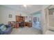 Comfortable office with built-in desk, shelving, and sliding glass doors to lanai at 525 Cheval Dr, Venice, FL 34292