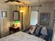 Lovely bedroom design with stylish décor, side table, and ample natural light at 533 Cervina N Dr # 773, Venice, FL 34285