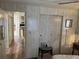 Bedroom with a hallway view, chair, and closets at 533 Cervina N Dr # 773, Venice, FL 34285