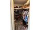 Organized walk-in closet with hanging rods, shelving, and ample storage space at 533 Cervina N Dr # 773, Venice, FL 34285