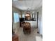Dining area with carpet, natural light from windows, and a small table at 533 Cervina N Dr # 773, Venice, FL 34285