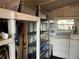 Practical laundry area with washer, dryer, sink, shelving, and storage for household needs at 533 Cervina N Dr # 773, Venice, FL 34285