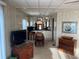 Neutral toned living room and dining area with built in cabinets and shelving at 533 Cervina N Dr # 773, Venice, FL 34285
