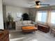 Inviting living room featuring neutral carpet, comfortable seating, and natural light at 533 Cervina N Dr # 773, Venice, FL 34285