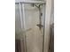 Accessible shower stall with grab bars and a handheld shower head, ensuring safety and convenience at 533 Cervina N Dr # 773, Venice, FL 34285