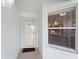 Close up of entry door featuring screen door and secured by modern keypad lock at 5725 Greenwood Ave # 1201, North Port, FL 34287