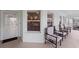 Welcoming porch featuring comfortable seating, an updated paint scheme and a screen door at 5725 Greenwood Ave # 1201, North Port, FL 34287