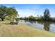 Scenic water view with lush greenery and trees along the river bank at 5725 Greenwood Ave # 1201, North Port, FL 34287