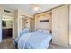 Bedroom featuring a murphy bed, storage cabinets and connecting bathroom area at 612 Bird Bay S Dr # 311, Venice, FL 34285