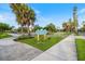 Centennial Park sign in the manicured garden at 612 Bird Bay S Dr # 311, Venice, FL 34285